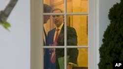 FILE - White House Counsel Pat Cipollone is seen during a meeting with President Donald Trump in the Oval Office of the White House, in Washington, Nov. 14, 2019.