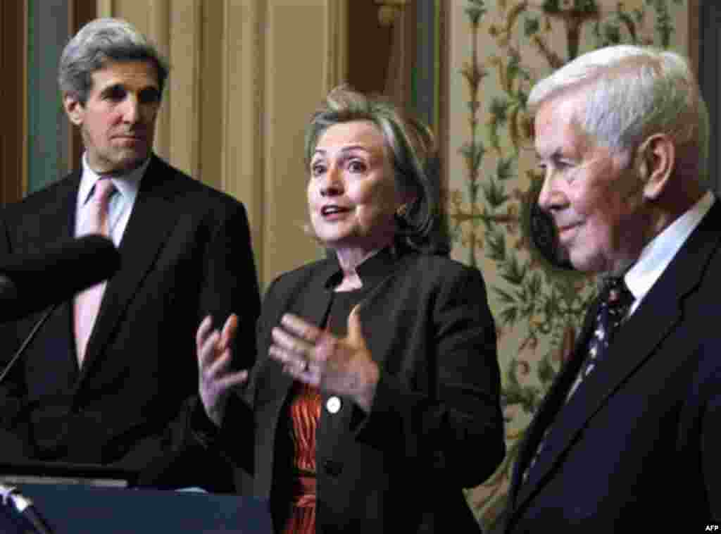 Secretary of State Hillary Rodham Clinton, center, flanked by Sen. John Kerry, D-Mass., left, and Sen. Richard Lugar, R-Ind., talks about the START Treaty following their meeting on Capitol Hill in Washington, Wednesday, Nov. 17, 2010. (AP Photo/Manuel 