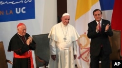 FILE - Pope Francis is pictured with Cardinal Ricardo Ezzati Andrello, left, at the Pontifical Catholic University of Chile in Santiago, Jan. 17, 2018.