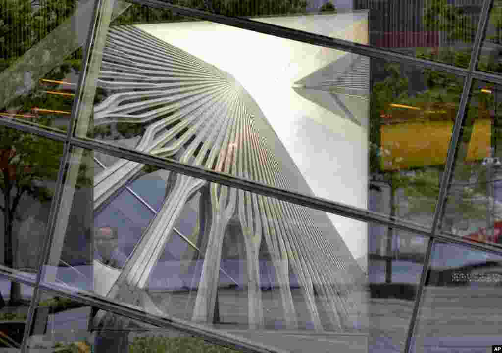 A man looks at a picture of the original World Trade Center tower, National September 11 Memorial Museum, New York City, May 15, 2014.