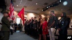 First lady Melania Trump, center, and acting DEA Administrator Uttam Dhillon, center left, stands at a Red Ribbon Rally at the Drug Enforcement Agency in Arlington, Virginia, Oct. 7, 2019. 