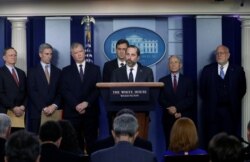 United States Secretary of Health and Human Services Secretary Alex Azar is accompanied by health officials as they speak to reporters during a news briefing at the White House in Washington, Jan. 31, 2020.