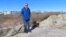 Mayor Patrick Rosenello stands next to a destroyed section of sand dune in North Wildwood, New Jersey, on Jan. 22, 2024. A winter storm punched a hole through what is left of the city's eroded dune system, leaving it more vulnerable than ever to flooding.