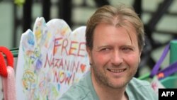 FILE - Richard Ratcliffe, husband of British-Iranian woman Nazanin Zaghari-Ratcliffe who is imprisoned in Iran takes part in a hunger strike outside the Iranian embassy in solidarity with his wife and protesting to call for her release in London, June 25,
