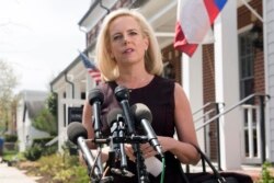 FILE - Then-Homeland Security Secretary Kirstjen Nielsen talks outside her home in Alexandria, Va., April 8, 2019.