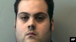 This booking photo released March 1, 2018, by the Beverly Police Department shows Daniel Frisiello, of Beverly, Mass., accused of mailing five envelopes earlier this month with threatening messages and a white substance, including one to Donald Trump Jr.