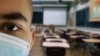 Boy with mask in a classroom