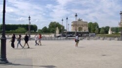 Pedestrians stroll on Paris' Right Bank. The European Union is opening its borders to tourists from only a few 'safe' countries, including Tunisia and Canada. (Lisa Bryant/VOA)