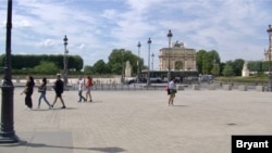 Pedestrians stroll on Paris' Right Bank. The European Union is opening its borders to tourists from only a few 'safe' countries, including Tunisia and Canada. (Lisa Bryant/VOA)