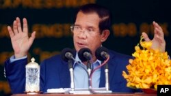 FILE - Cambodia's Prime Minister Hun Sen delivers a speech during a groundbreaking ceremony to build the country's first expressway, in Kampong Speu province, south of Phnom Penh, Cambodia, Friday, March 22, 2019.