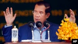 In this file photo taken on March 22, 2019, Cambodia's Prime Minister Hun Sen delivers a speech during a groundbreaking ceremony to build the country's first expressway, in Kampong Speu province, south of Phnom Penh, Cambodia.