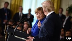 La chancelière allemande Angela Merkel lors d'une conférence de presse conjointe avec le président américain Donald Trump à la Maison Blanche, à Washington, le 27 avril 2018.