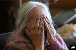 Delaine Spilsbury, a member of the Ely Shoshone tribe, gestures during an interview at her home on Nov. 12, 2023, near McGill, Nev. She has worked for years to have the Bahsahwahbee massacre site named as a national monument. (AP Photo/Rick Bowmer)