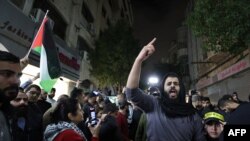 FILE —Palestinians chant slogans during a protest on November 18, 2023 in the West Bank city of Ramallah, against reported Israeli stikes on the Jabalia refugee camp in Gaza earlier, amid the ongoing battles between Israel and the militant group Hamas.