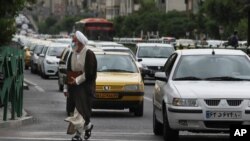 Traffic backs up at an intersection in downtown Tehran, Iran, Tuesday, May 11, 2021. (AP Photo/Vahid Salemi)