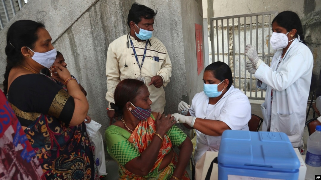 A health worker administers the Covishield vaccine for COVID-19 during a special vaccination drive in Hyderabad, India, Sept. 17, 2021. 