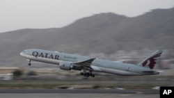 A Qatar Airways aircraft takes off with foreigners from the airport in Kabul, Afghanistan, Sept. 9, 2021, in the first such large-scale departure since U.S. and foreign forces concluded their frantic withdrawal from the country late last month.