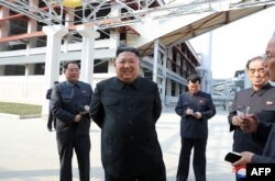 This picture taken on May 1, 2020 and released by North Korea's official Korean Central News Agency on May 2, 2020, shows North Korean leader Kim Jong Un visiting the completed Suchon fertilizer factory.