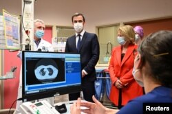 French Health Minister Olivier Veran and French Junior Minister of Autonomy Brigitte Bourguignon visit the coronavirus disease emergency and intensive care units of the Hospital Centre in Dunkirk, Feb. 24, 2021.