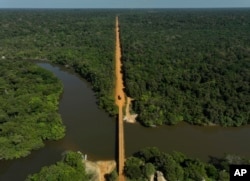 The trans-Amazon highway crosses the Assua River near the Juma Indigenous community near Canutama, Amazonas state, Brazil, Monday, July 10, 2023.