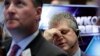 FILE - Trader John Panin, right, works on the floor of the New York Stock Exchange, Oct. 17, 2016. By the end of the week, the Dow Jones Industrial Average had rebounded from a triple-digit loss.