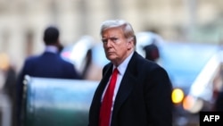 FILE - Former U.S. President Donald Trump arrives at 40 Wall Street after a court hearing for his trial for allegedly covering up hush money payments linked to extramarital affairs, in New York City, on March 25, 2024.