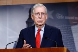 FILE - In this April 21, 2020, file photo Senate Majority Leader Mitch McConnell of Ky., speaks with reporters on Capitol Hill in Washington.