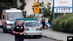 A police officer walks in front of the Benjamin-Franklin Hospital in the southwestern district of Steglitz in Berlin, Germany, July 26, 2016. 