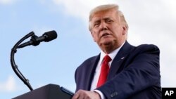 President Donald Trump speaks during a campaign rally at Wittman Airport, Monday, Aug. 17, 2020, in Oshkosh, Wis. (AP Photo/Evan Vucci)