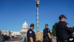 FILE - A video surveillance apparatus is seen on the East Front of the Capitol in Washington, Sept. 10, 2021.