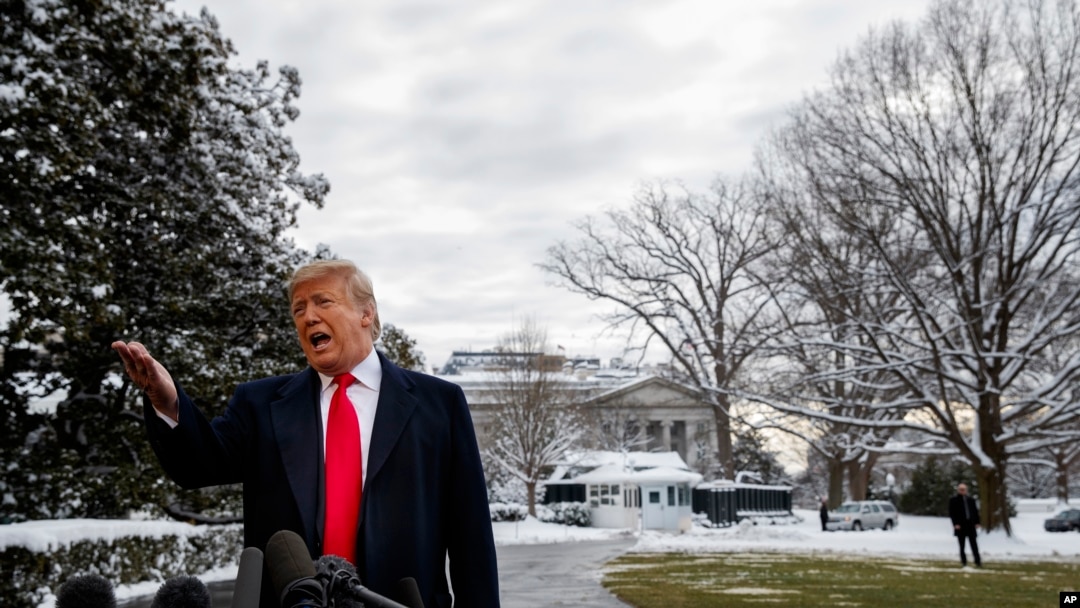 President Donald Trump talks with reporters on the South Lawn of the White House before departing for the American Farm Bureau Federation's 100th Annual Convention in New Orleans, Jan. 14, 2019, in Washington.