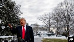 President Donald Trump talks with reporters on the South Lawn of the White House before departing for the American Farm Bureau Federation's 100th Annual Convention in New Orleans, Jan. 14, 2019, in Washington.