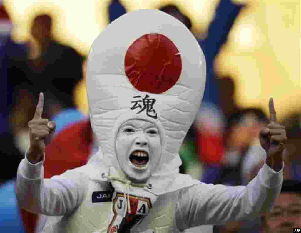 A supporter of the Japan team cheers during the World Cup group E soccer match between Japan and Cameroon at Free State Stadium in Bloemfontein, South Africa, Monday, June 14, 2010. (AP Photo/Shuji Kajiyama)