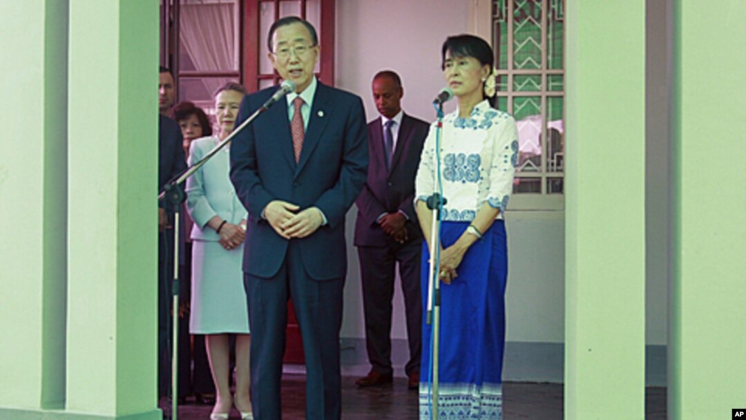 U.N. Secretary-General Ban Ki-moon, left, talks to reporters during a press conference following his meeting with Myanmar pro-democracy leader Aung San Suu Kyi, right, at her lakeside residence in Yangon, Myanmar, May.1, 2012.