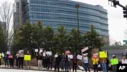 Demonstrators protest Centers for Disease Control and Prevention layoffs in front of the CDC headquarters in Atlanta, Feb. 18, 2025. 