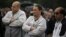  PSA Peugeot-Citroen employees in front of factory in Aulnay-sous-Bois, north of Paris, July 12, 2012.