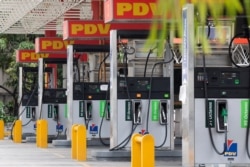 FILE - Closed gas pumps stand at a PDVSA gas station in Caracas, Venezuela, Sept. 8, 2020.