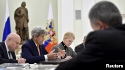 U.S. Secretary of State John Kerry (2nd L) speaks during a meeting with Russian President Vladimir Putin (not pictured) at the Kremlin in Moscow, March 24, 2016.