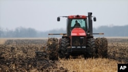 FILE - A farmer cultivates his field near Farmingdale, Ill., Dec. 4, 2009.