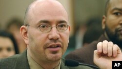 FILE - Mike Feinberg, co-founder of the KIPP Academy Charter School in Houston, responds to a question during a meeting in Austin, Texas, Jan. 22, 2004.