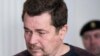 Suspected Lithuanian hacker Evaldas Rimasauskas is seen before a court session in Vilnius, Lithuania, Thursday, May 18, 2017.