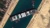 This satellite image from Maxar Technologies shows the cargo ship MV Ever Given stuck in the Suez Canal near Suez, Egypt, March 27, 2021.