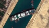 This satellite image from Maxar Technologies shows the cargo ship MV Ever Given stuck in the Suez Canal near Suez, Egypt, March 27, 2021.