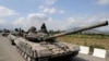 FILE - A Georgian tank moves along a road near the city of Tskhinvali, 100 km (62 miles) from Tbilisi, Aug. 8, 2008. 