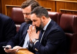 Santiago Abascal, leader of the Spanish far-right party Vox, reacts upon arrival at the first session of the Parliament following a general election in Madrid, Spain Dec. 3, 2019.