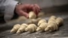 French baker Arnaud Delmontel bakes butter croissants in Paris, Dec. 16, 2024.