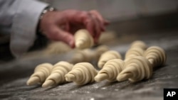 French baker Arnaud Delmontel bakes butter croissants in Paris, Dec. 16, 2024.