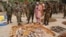 Military officials stand near ammunitions seized from suspected members of Hezbollah after a raid of a building in Kano, Nigeria, May 30, 2013.