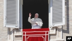 FILE - Pope Francis delivers a blessing from his studio window overlooking St. Peter's Square on the occasion of the Angelus noon prayer at the Vatican, Feb. 4, 2018. 