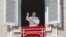 FILE - Pope Francis delivers a blessing from his studio window overlooking St. Peter's Square on the occasion of the Angelus noon prayer at the Vatican, Feb. 4, 2018. 
